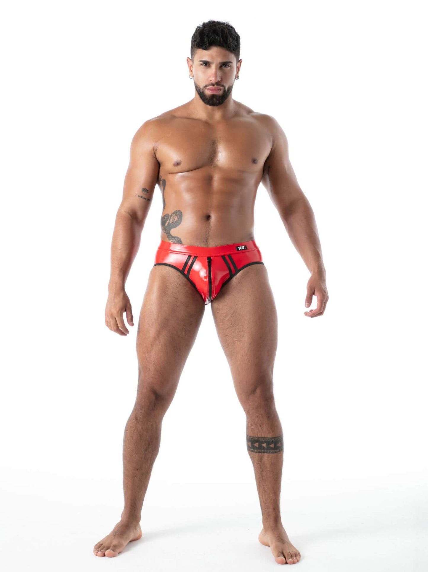 Man wearing red  latex underwear  on a white background