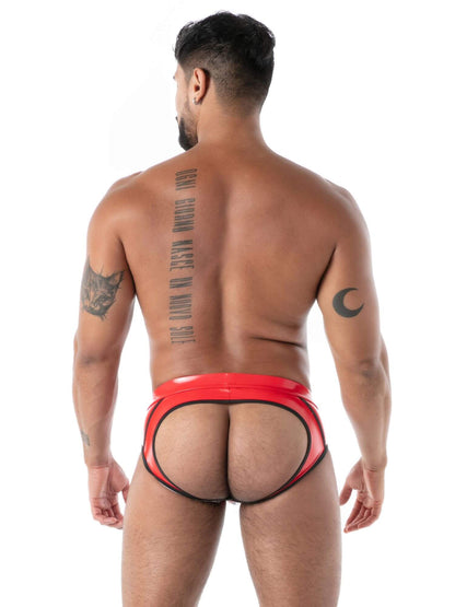 Man wearing red latex underwear on a white background