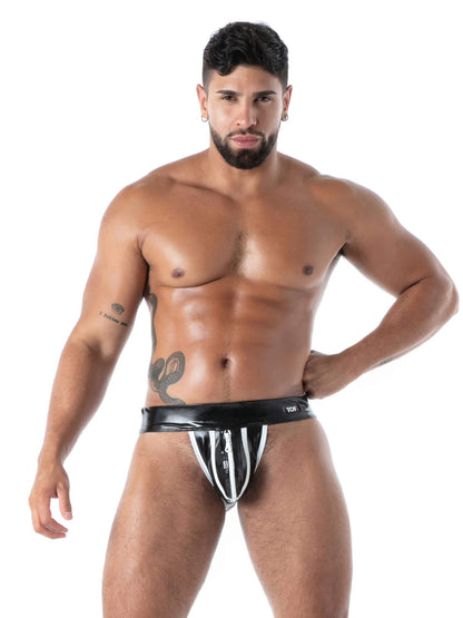 Man wearing a black and white striped jockstrap on a white background