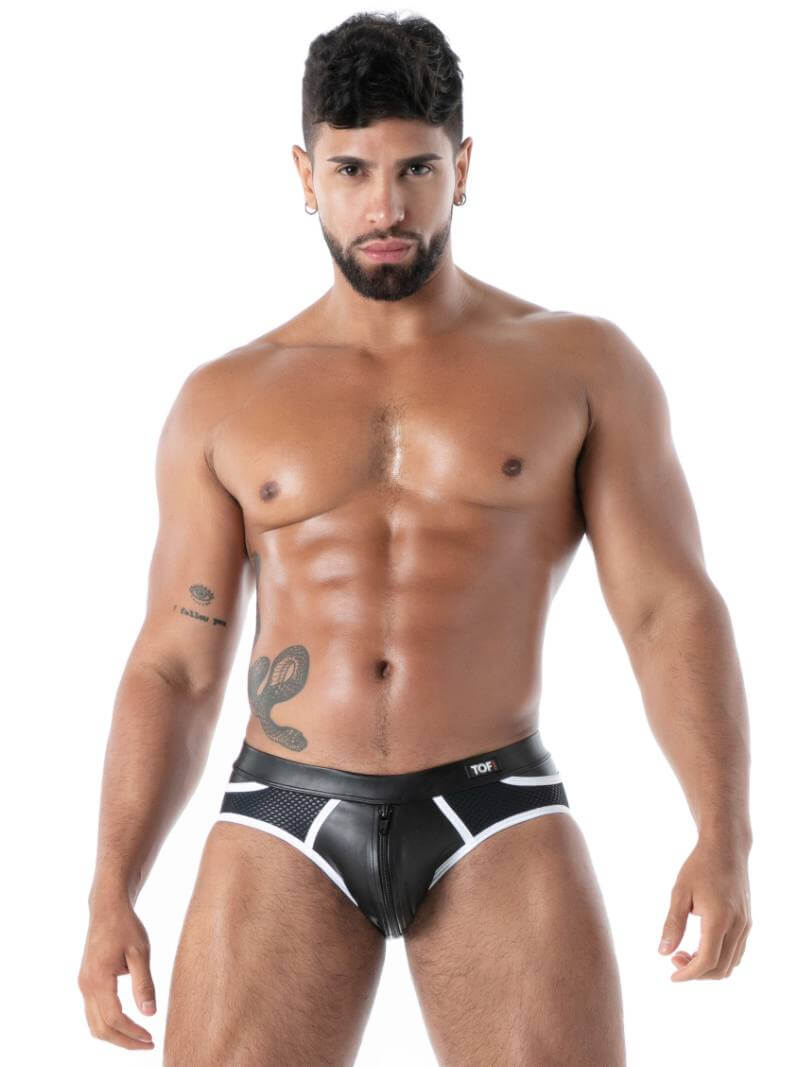 Man wearing black leather men's underwear on a white background