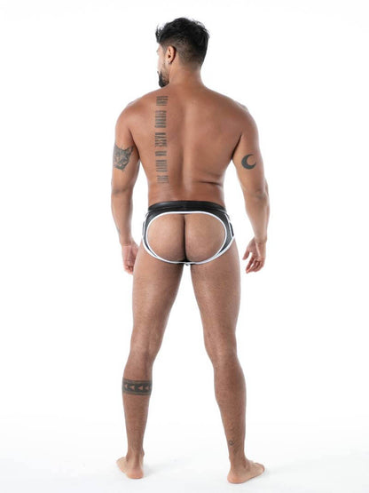 Man wearing a black leather backless brief on a white background
