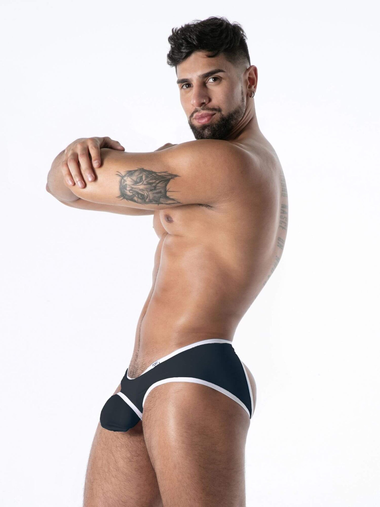 Man wearing black men's underwear with white trim on a white background