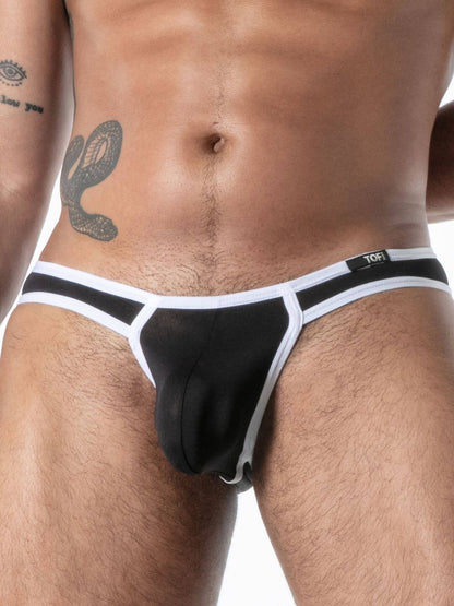 Black and white men's underwear with visible brand logo on a neutral background