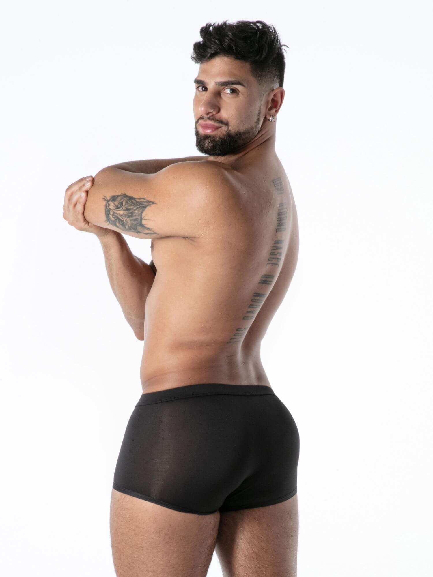 Man wearing black underwear on a white background
