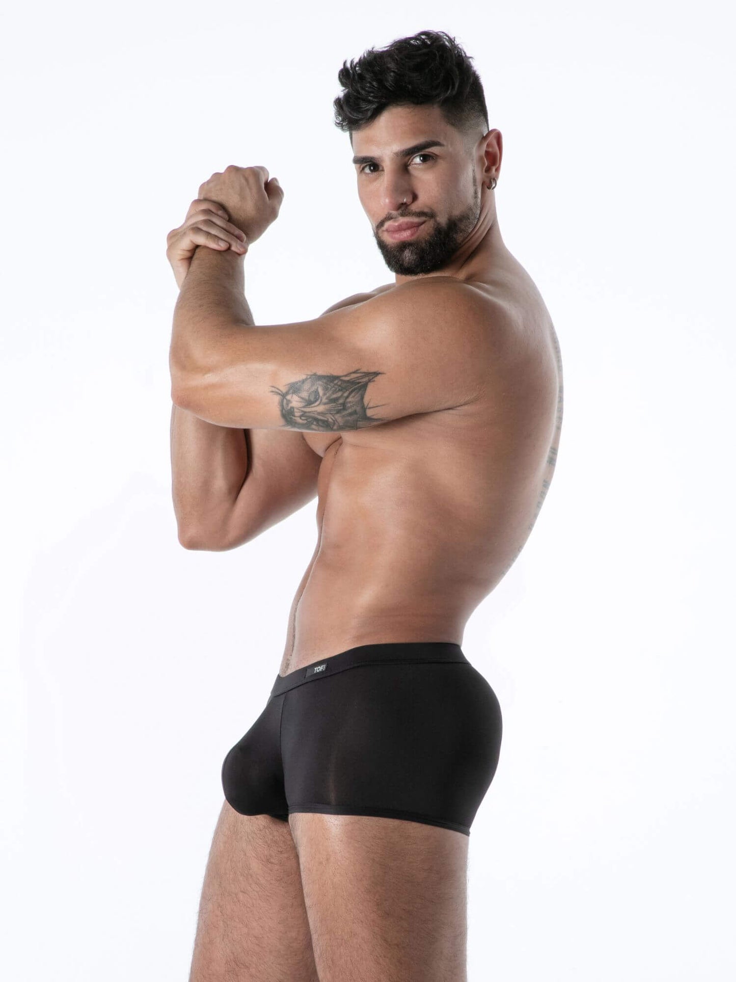 Man wearing black underwear on a white background