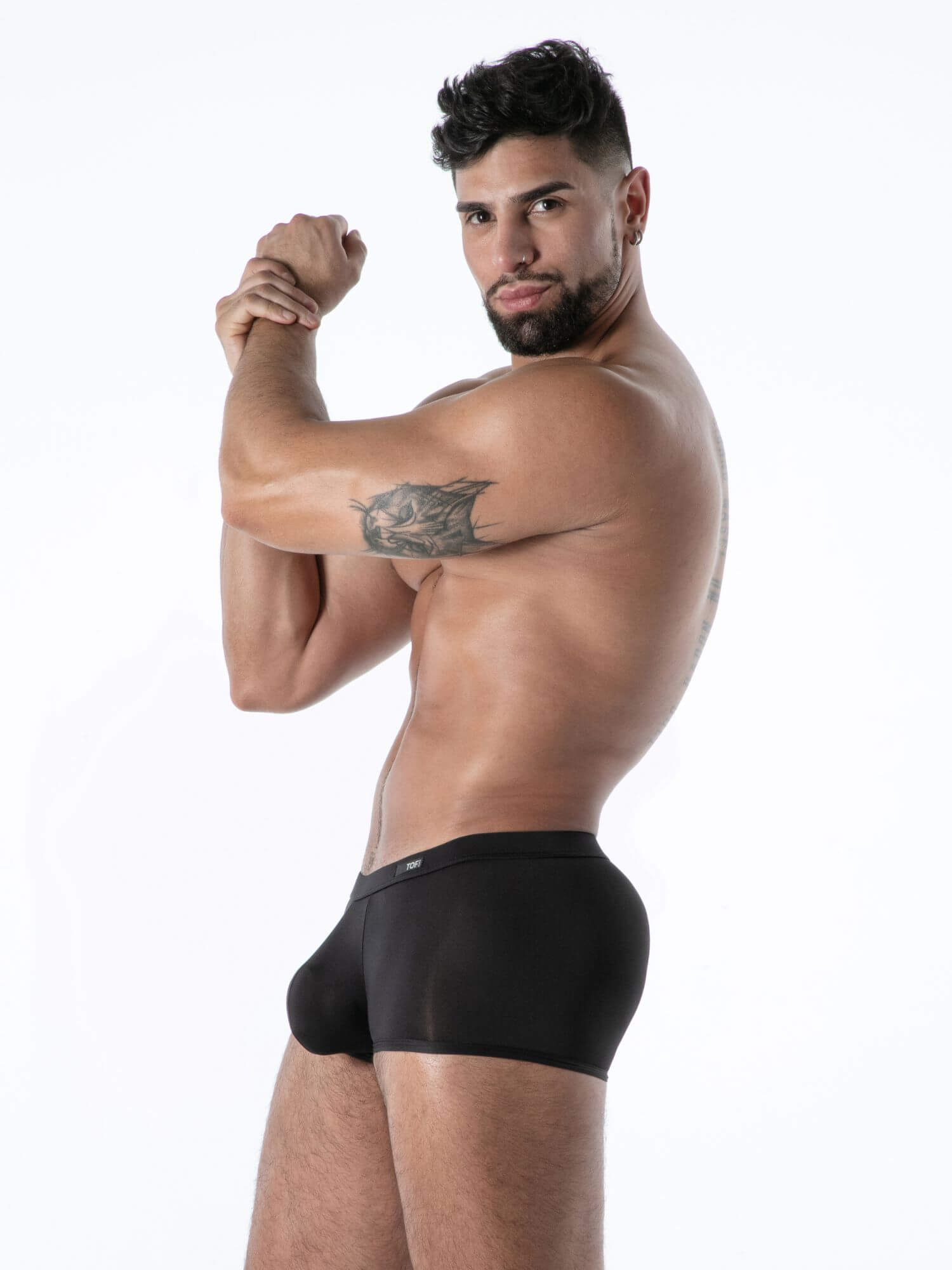 Man wearing black underwear on a white background