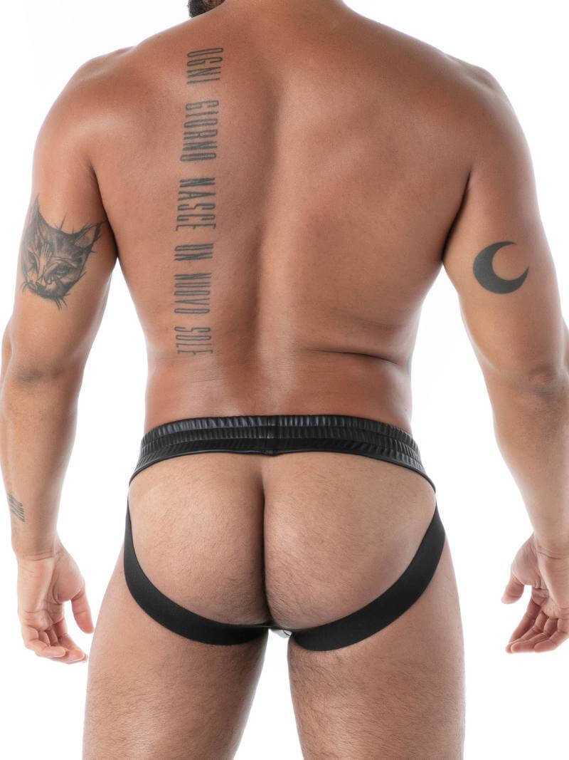 Man wearing a black leather jockstrap on a white background