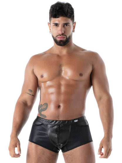 Man wearing black boxer briefs on a white background