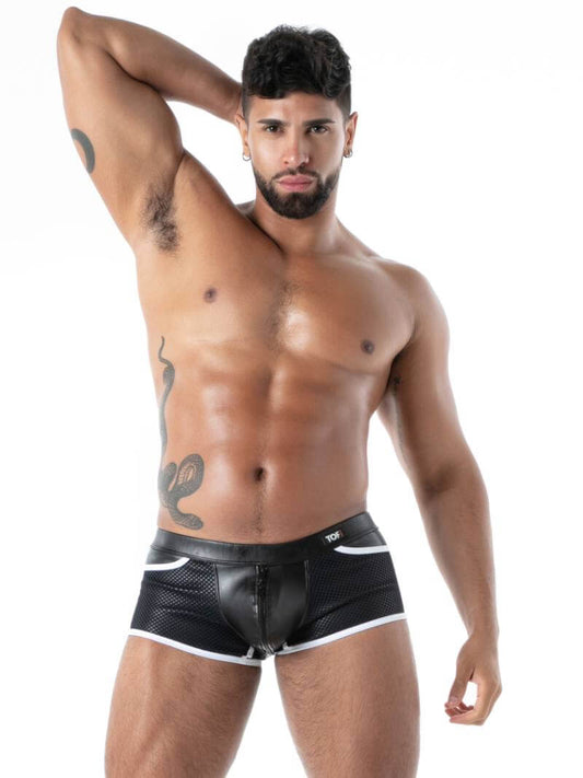 Man wearing black leather-like underwear on a white background