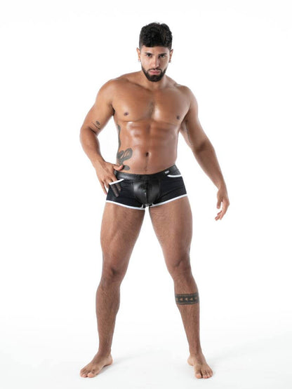 Man wearing black leather shorts on a white background