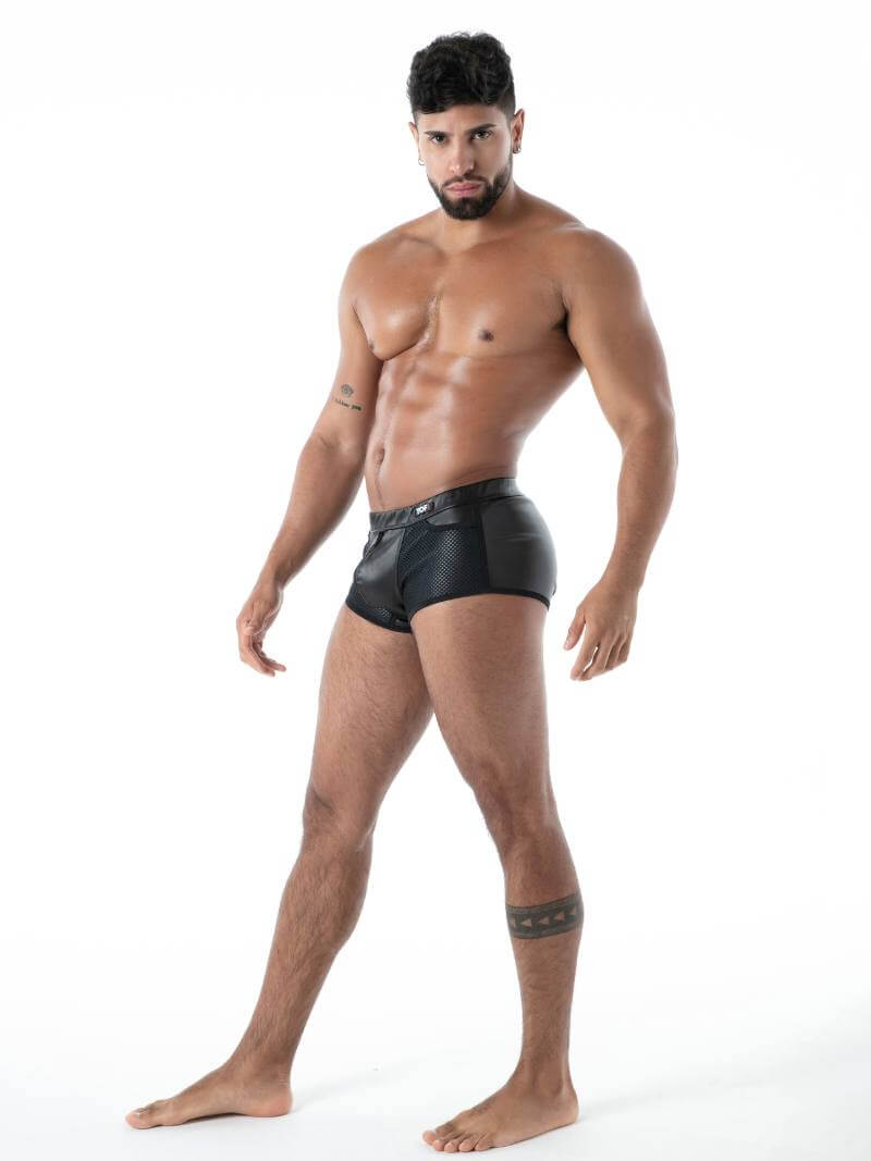Man wearing black underwear on a white background