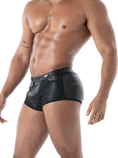 Man wearing black boxer briefs on a white background