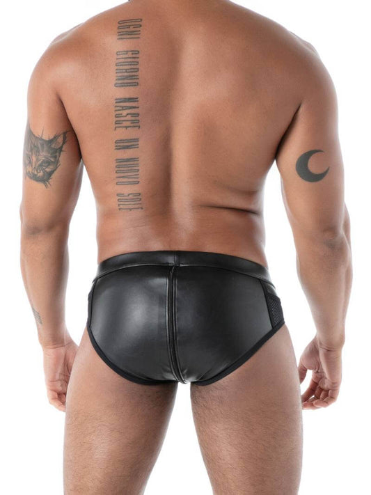 Man wearing black leather underwear on a white background