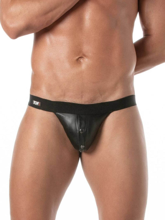 Man wearing a black leather jockstrap on a white background