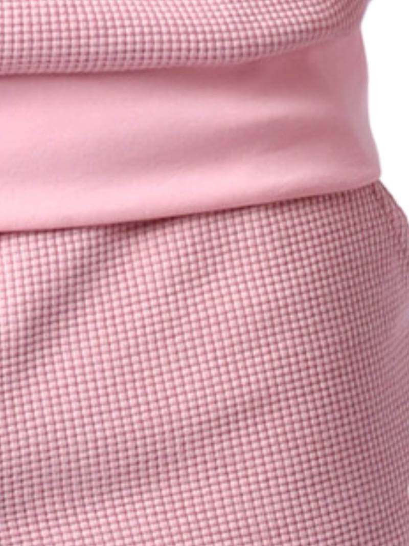 Close-up of pink checkered shorts on a white background