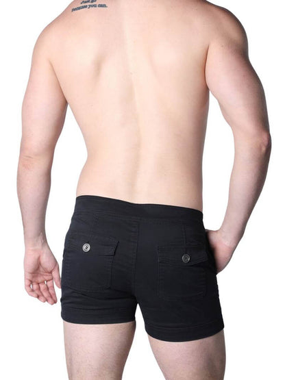 Man wearing black boxer shorts with buttons on a white background