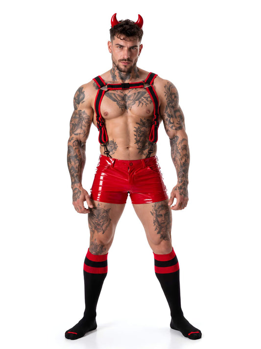 Model wearing a devil inspired Halloween outfit with red Locker Gear harness, shiny vinyl red shorts and long socks