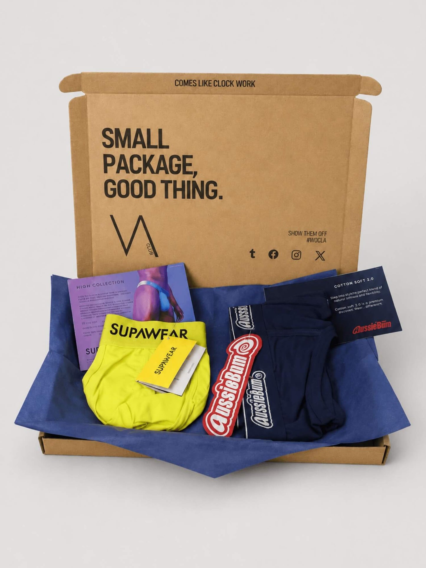 An example of the VA Club men's underwear subscription box service by VOCLA with two underwear products and product cards in a branded cardboard box