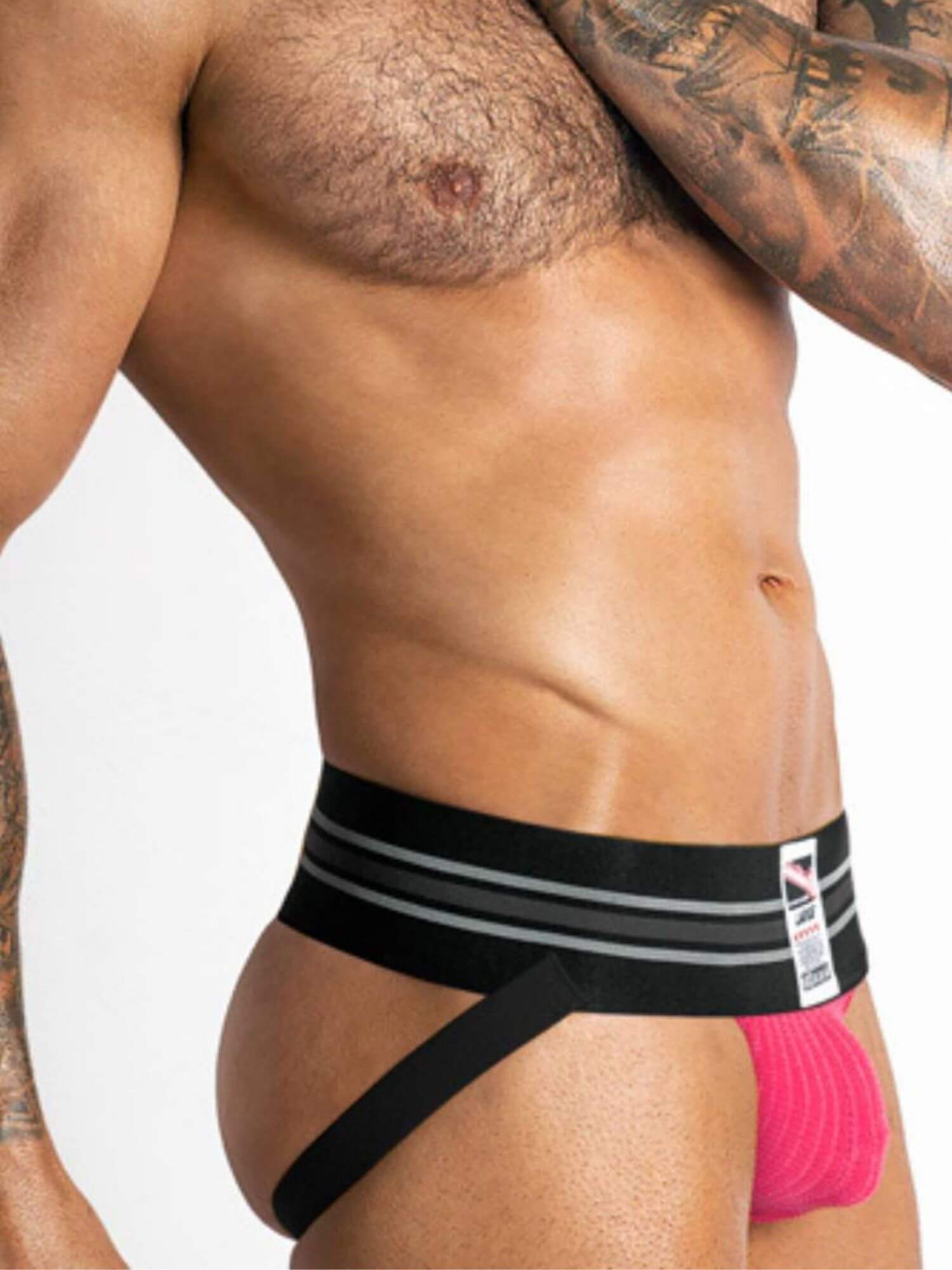 Man wearing black and pink underwear with a white background