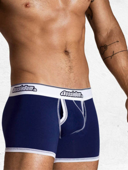 Navy blue underwear with white waistband featuring 'AussieBum' brand on a plain background.