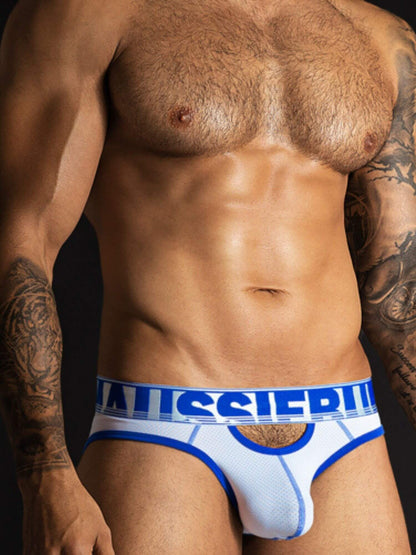 Man wearing white underwear with a brand logo on a dark background