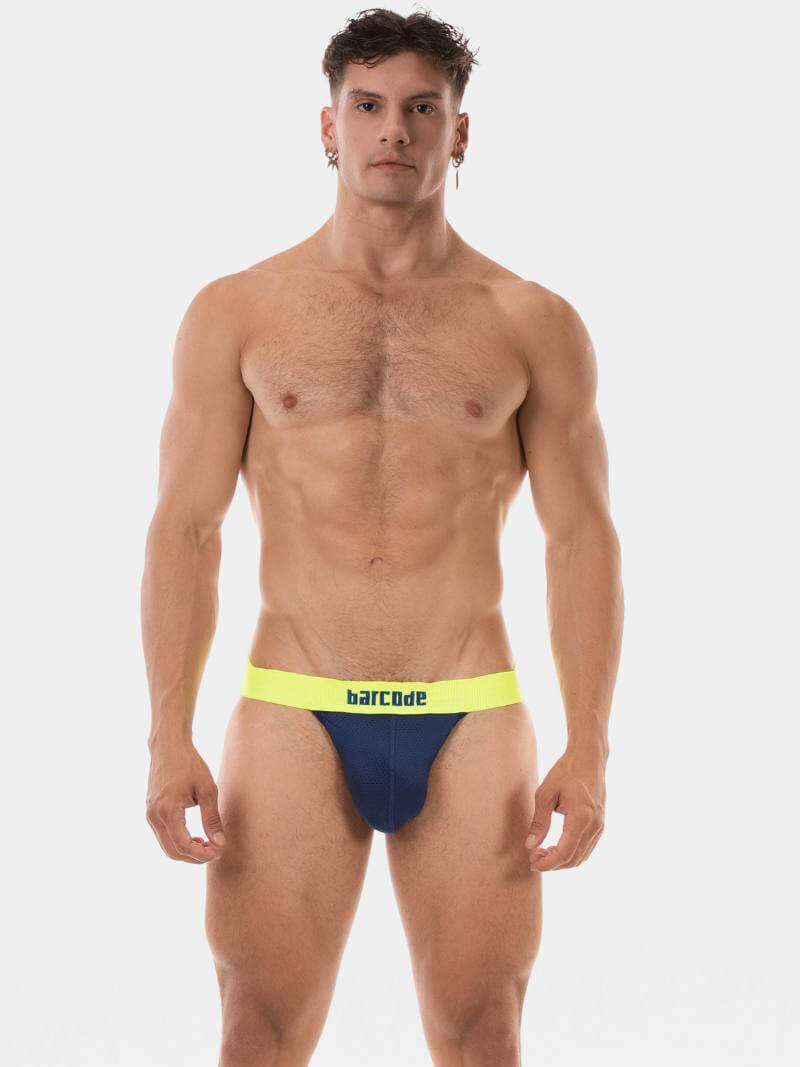 Man wearing blue and yellow swim briefs with 'Barcode' branding on a white background