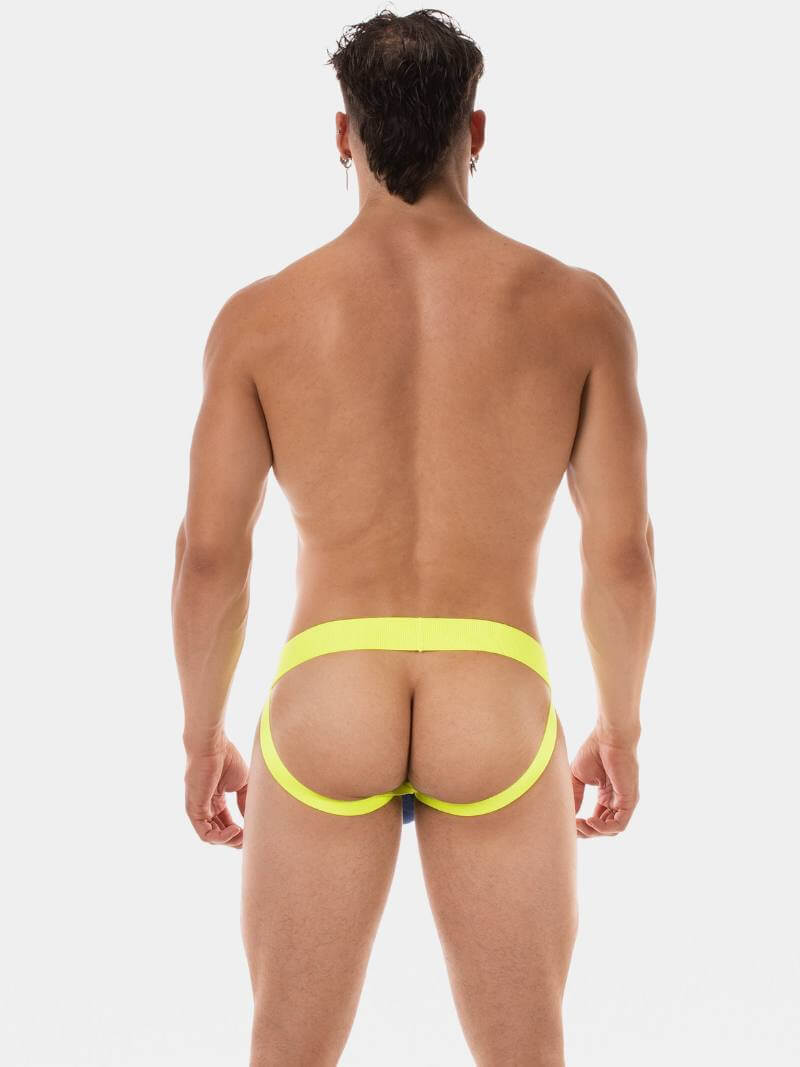 Man wearing a bright yellow men's underwear on a white background