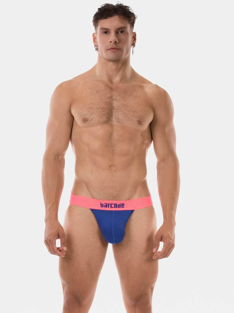 Man wearing a colorful swim brief on a white background