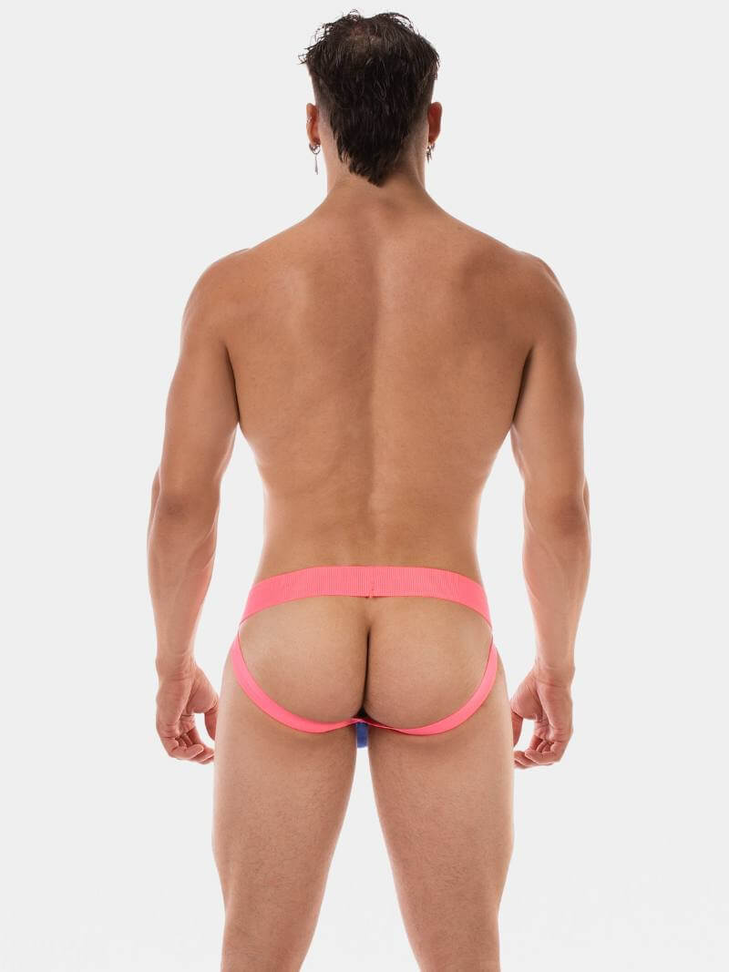 Man wearing a pink thong against a white background