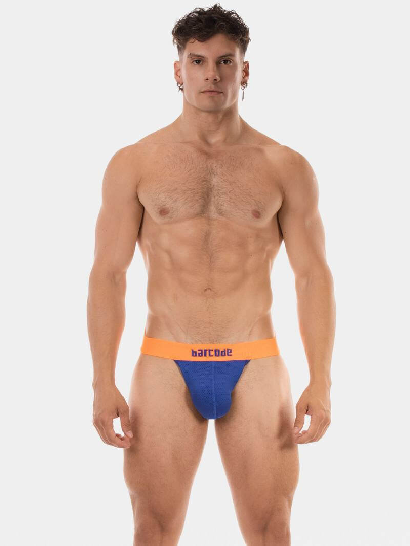 Man wearing a blue and orange swim brief on a white background