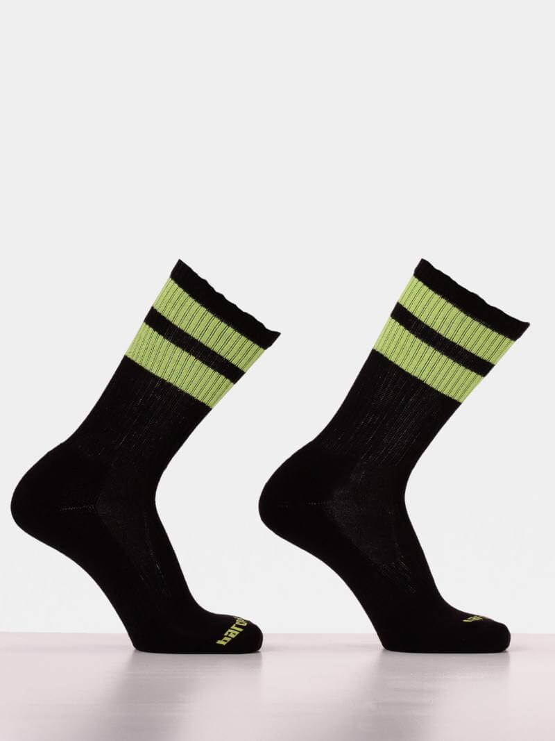 Black socks with green stripes on a white background