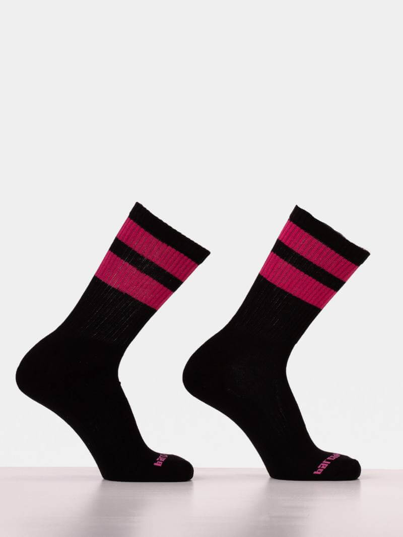 Black socks with pink stripes on a white background
