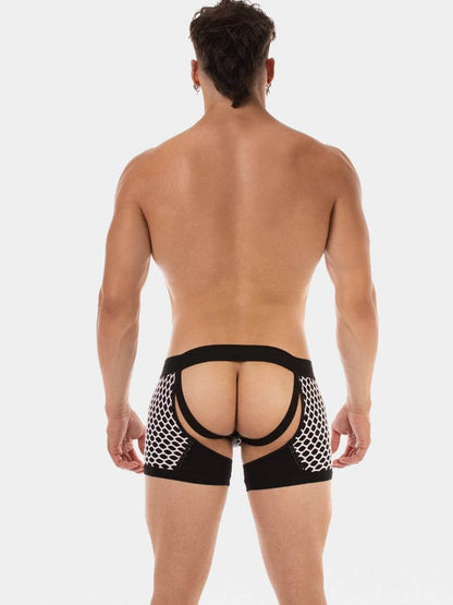 Man wearing a black mesh thong on a white background