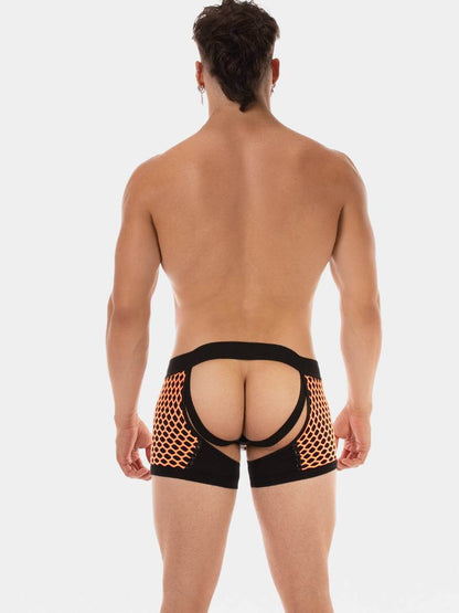 Man wearing black and orange mesh underwear on a white background