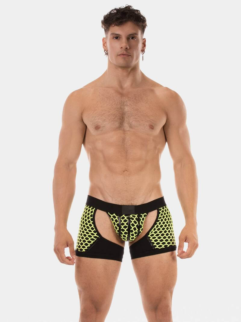 Man wearing black and yellow patterned underwear on a white background