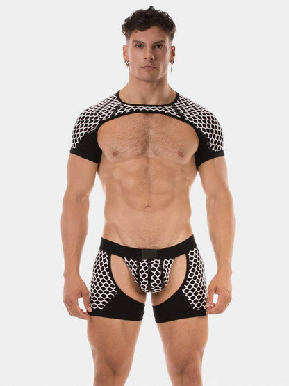 Man wearing black and white patterned mesh harness on a white background