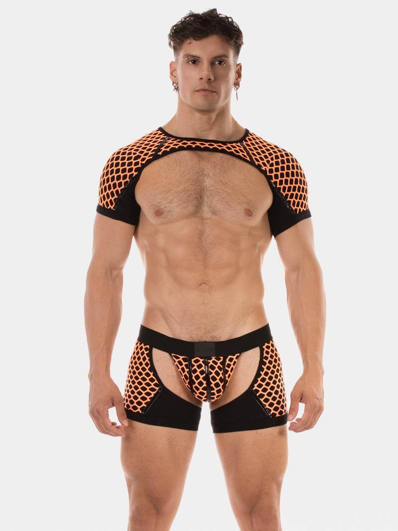 Man wearing black and orange mesh harness on a white background