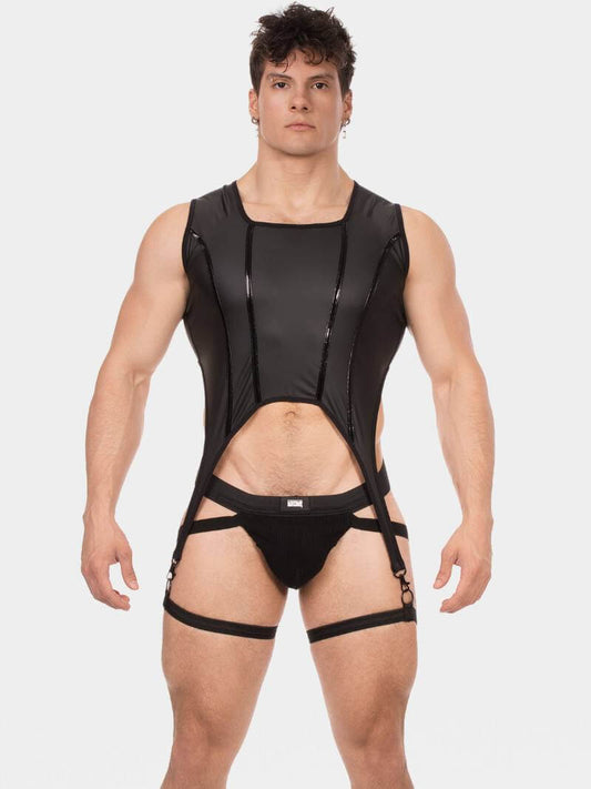 Man wearing a black strappy outfit on a white background