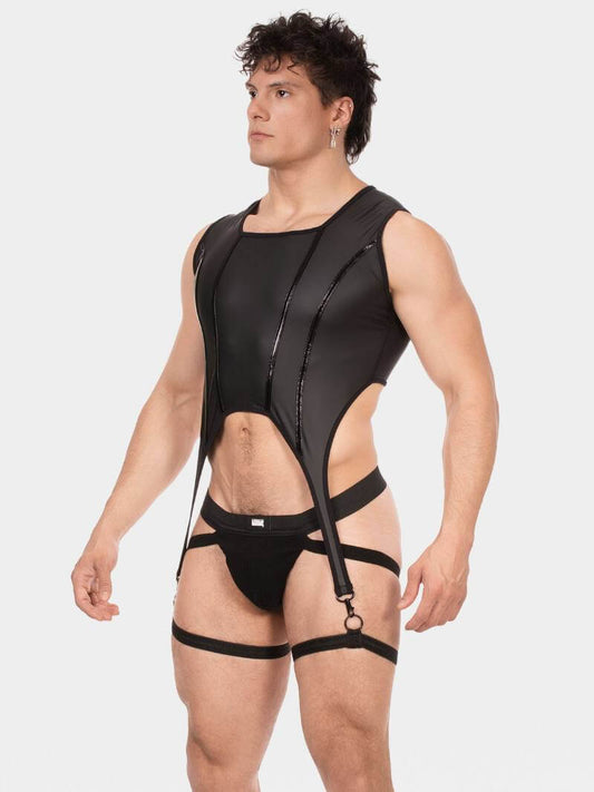 Man wearing a black harness against a white background