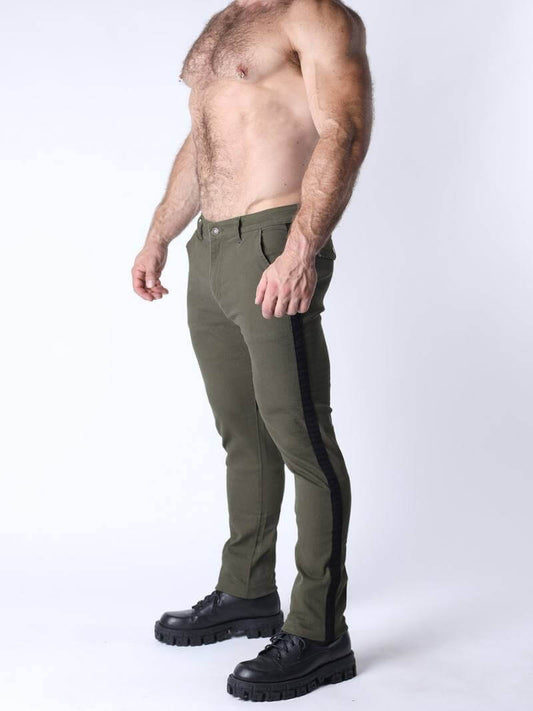Man wearing green pants with a black stripe on a white background