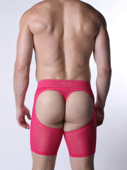 Person wearing bright pink underwear on a plain background