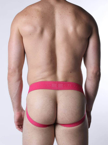 Person wearing a pink thong against a white background