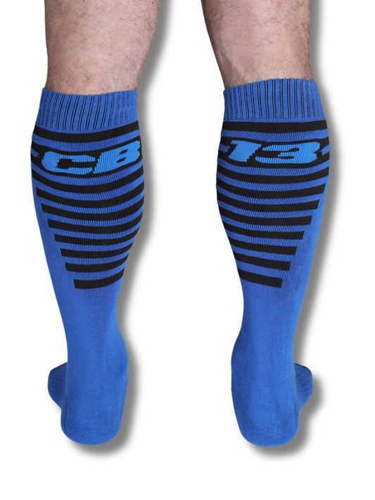 Blue knee-high socks with black stripes and 'CB13' logo on a white background