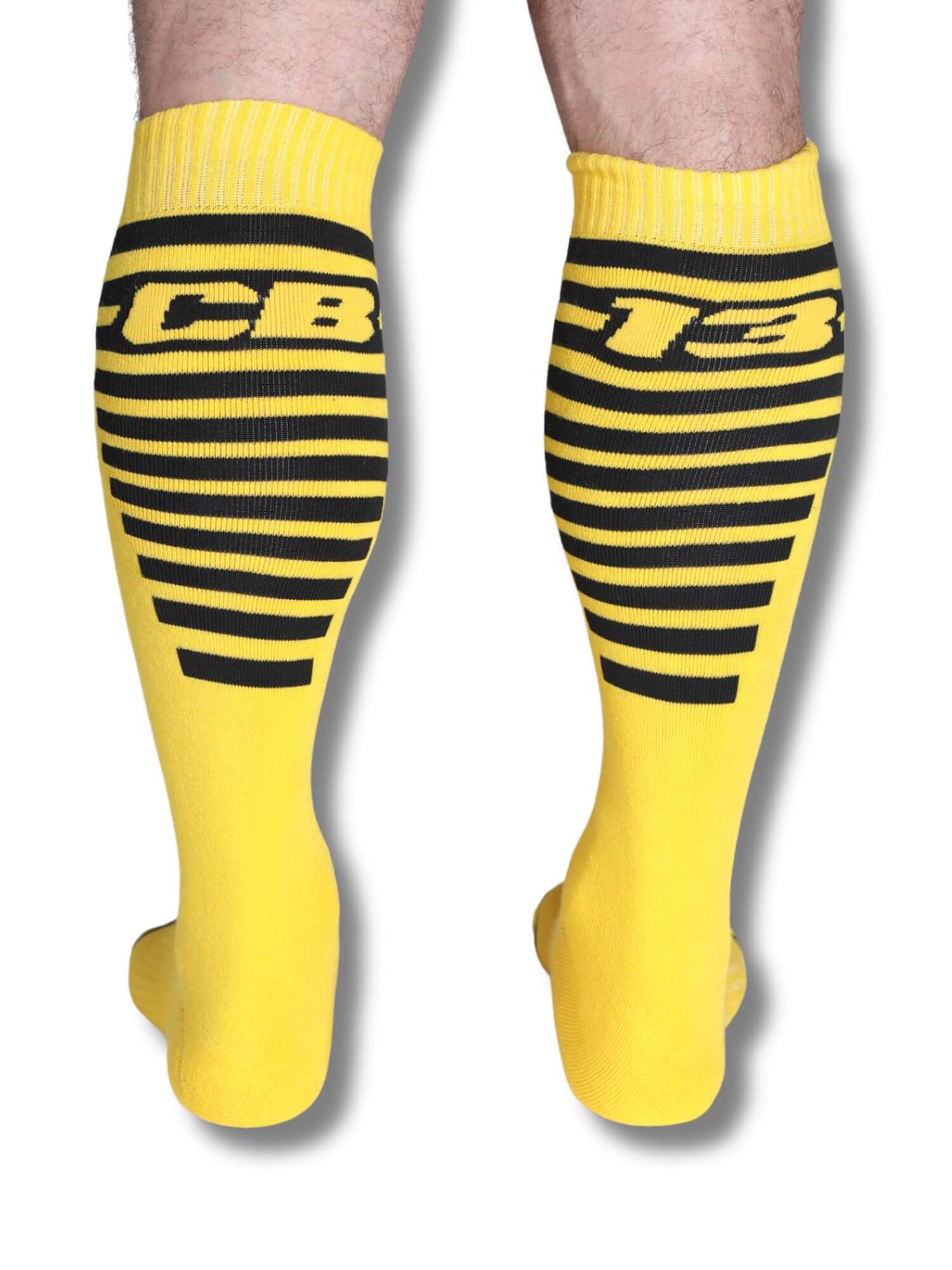 Yellow knee-high socks with black stripes and 'CB13' branding on a white background