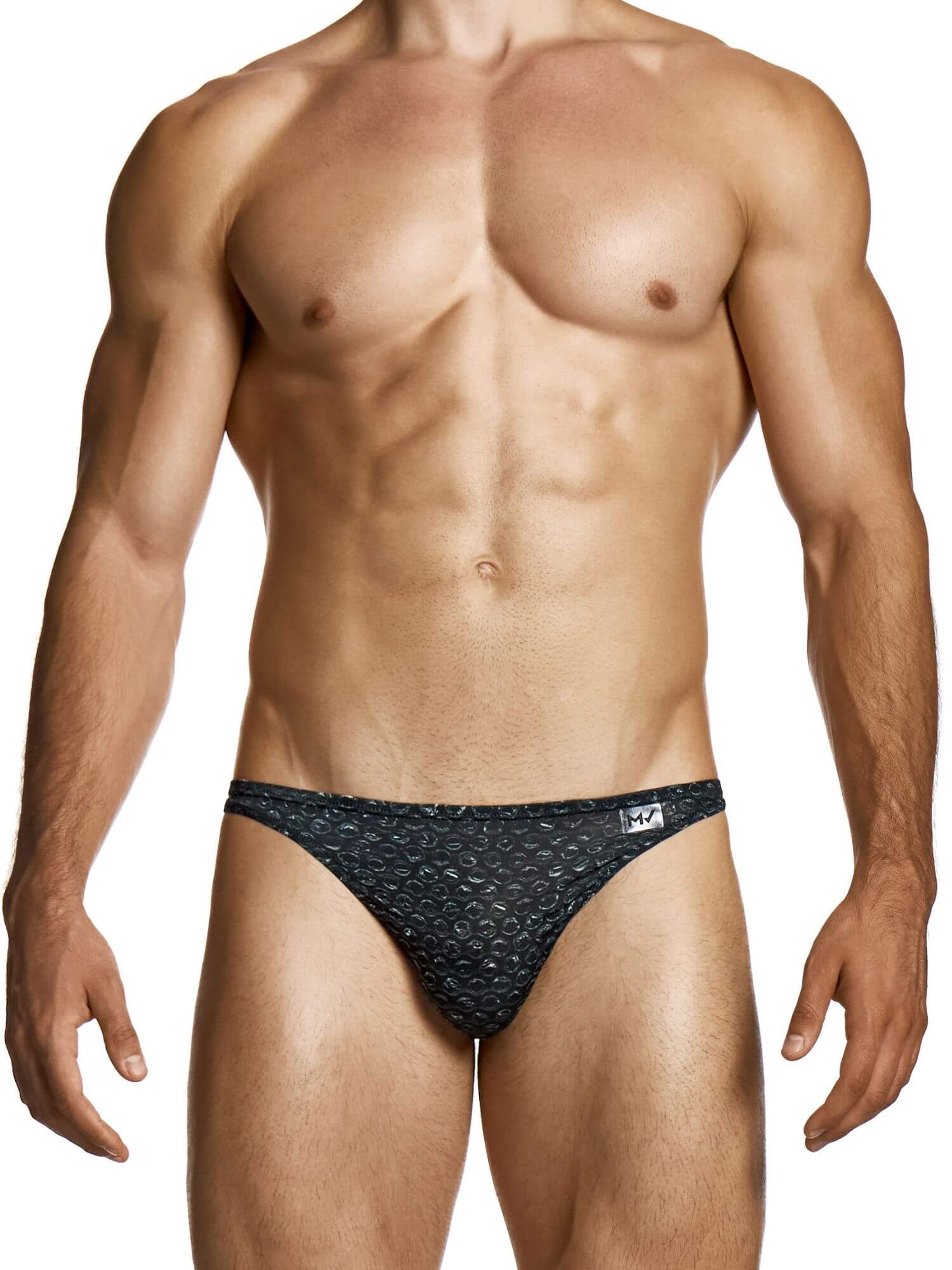 Man wearing a black patterned low rise brief on a white background
