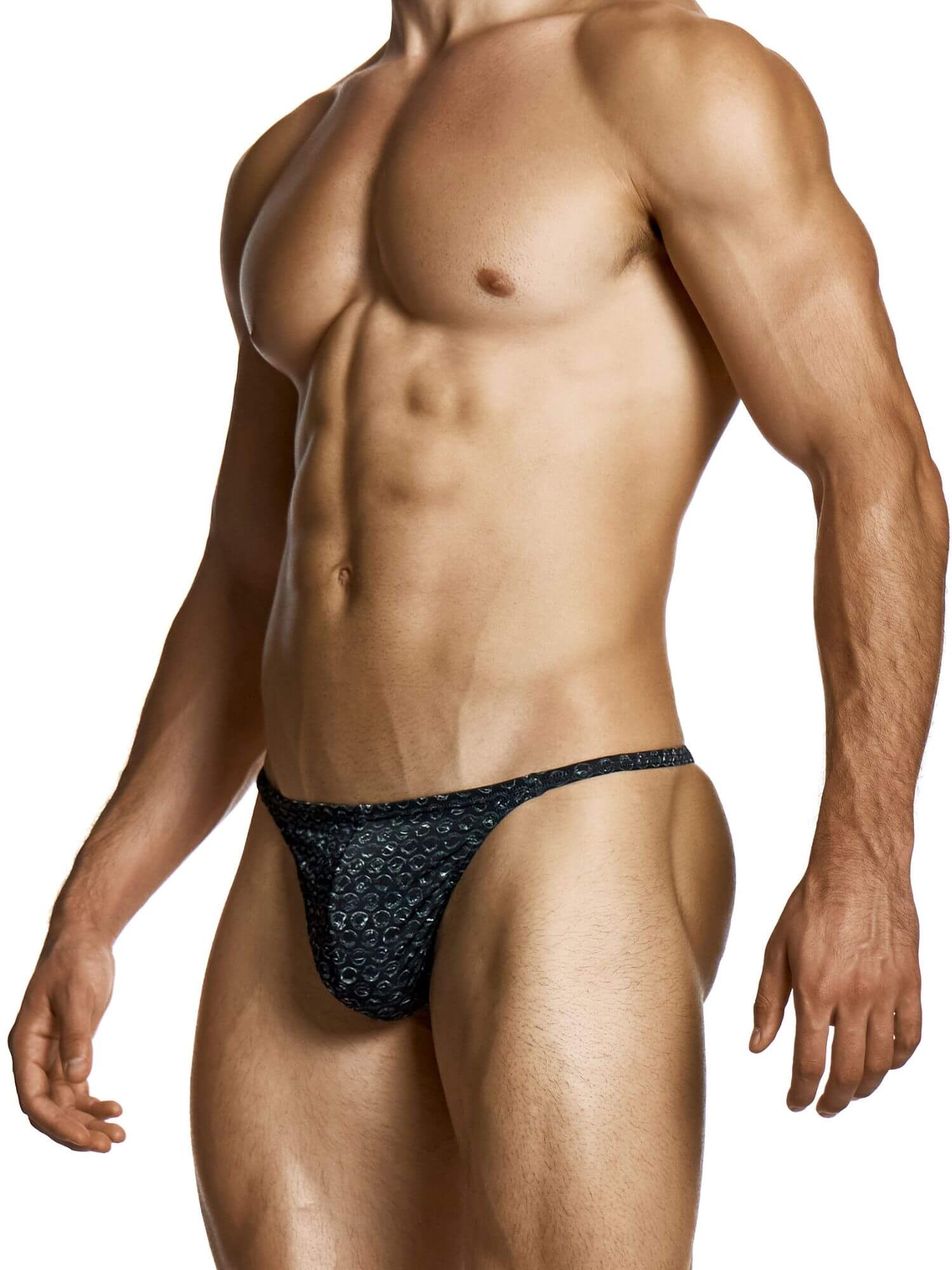 Man wearing a black patterned thong on a white background