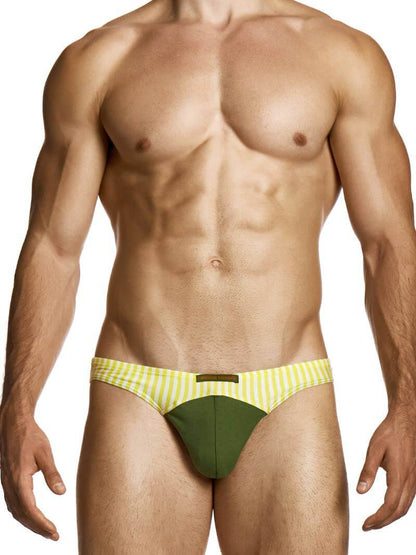 Man wearing a green and yellow striped men's underwear on a white background