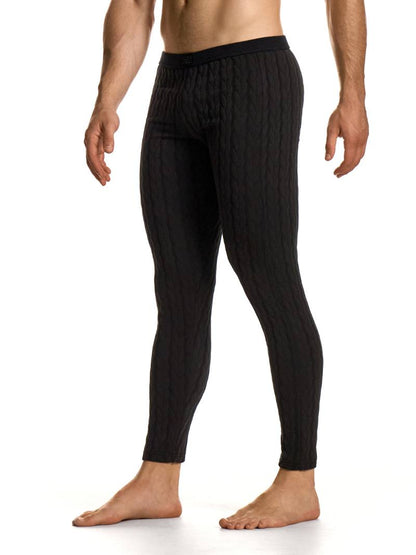 Black ribbed men's lounge pants worn by a person on a white background