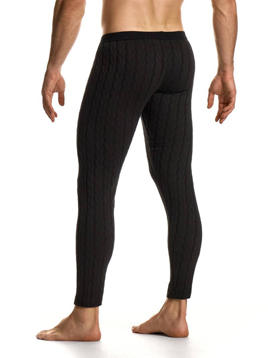 Black ribbed leggings worn by a person on a white background