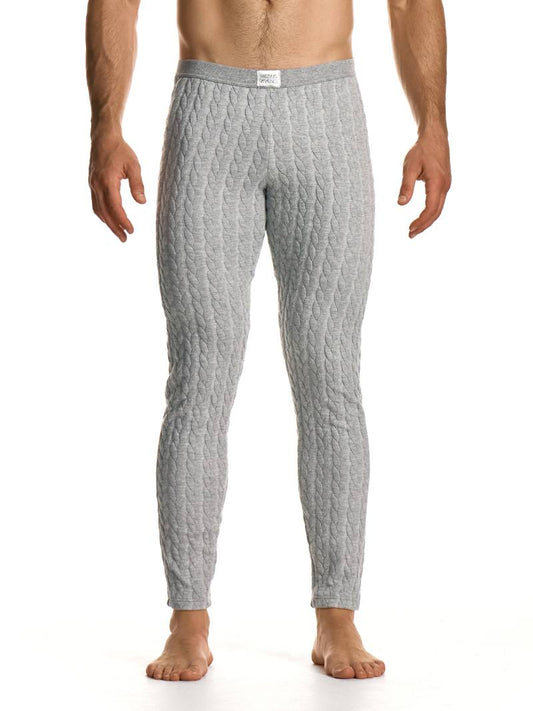 Man wearing gray textured pants on a white background